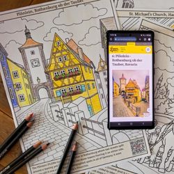 Germany coloring page with pencils, and a mobile phone with photo of the Plönlein on the screen.