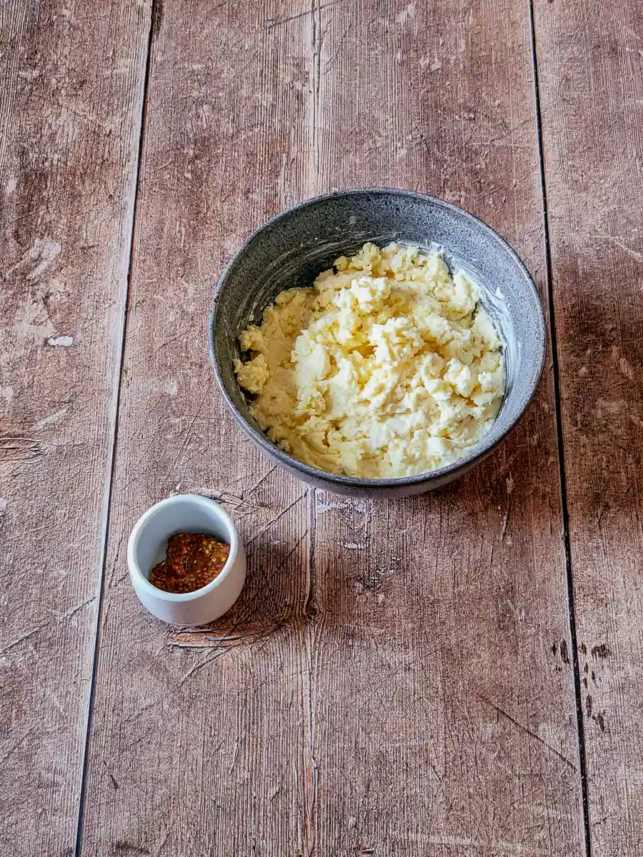 Obatzda ready for mustard Mashed Camembert, smoked cheddar, and cream cheese mixed with mustard for Bavarian Obatzda dip base.
