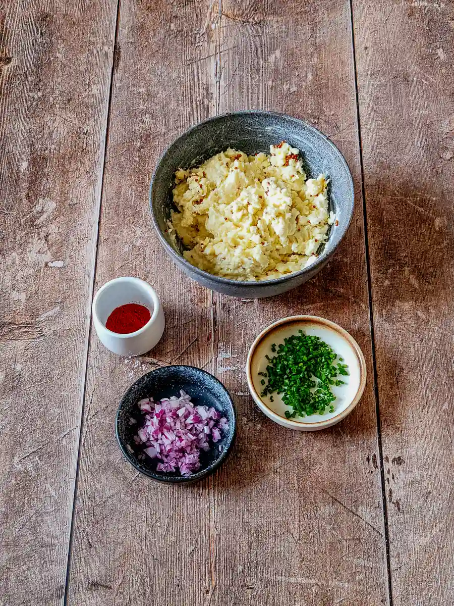 Obatzda before the extra flavors are added. Mashed Camembert, smoked cheddar, and cream cheese mixed with mustard for Bavarian Obatzda dip base.