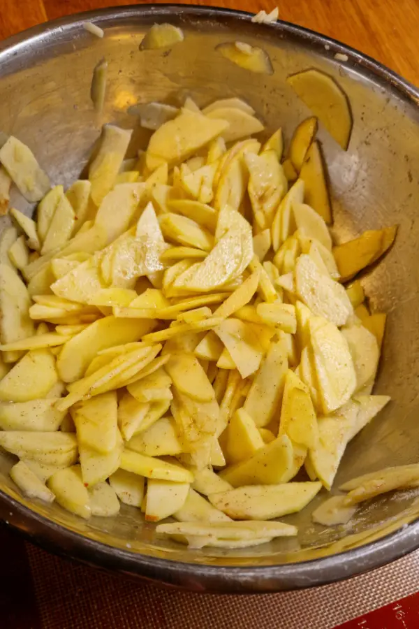 Sliced apples in a silver bowl