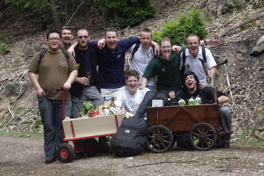 Group of men celebrating Vatertag with handcarts outdoors.
