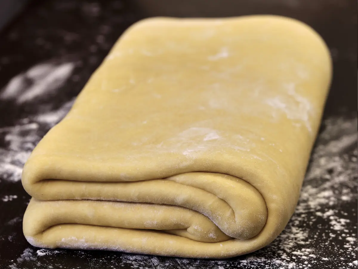 Traditional dough preparation. Folded dough on a plate