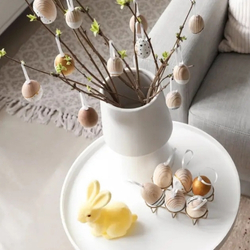 Table of Easter Memorabilia including a small yellow bunny and Easter eggs