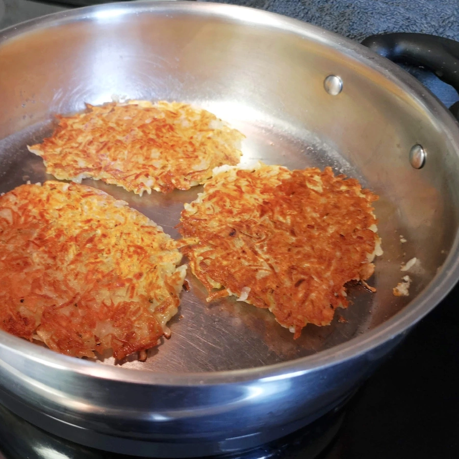 frying German potato pancakes