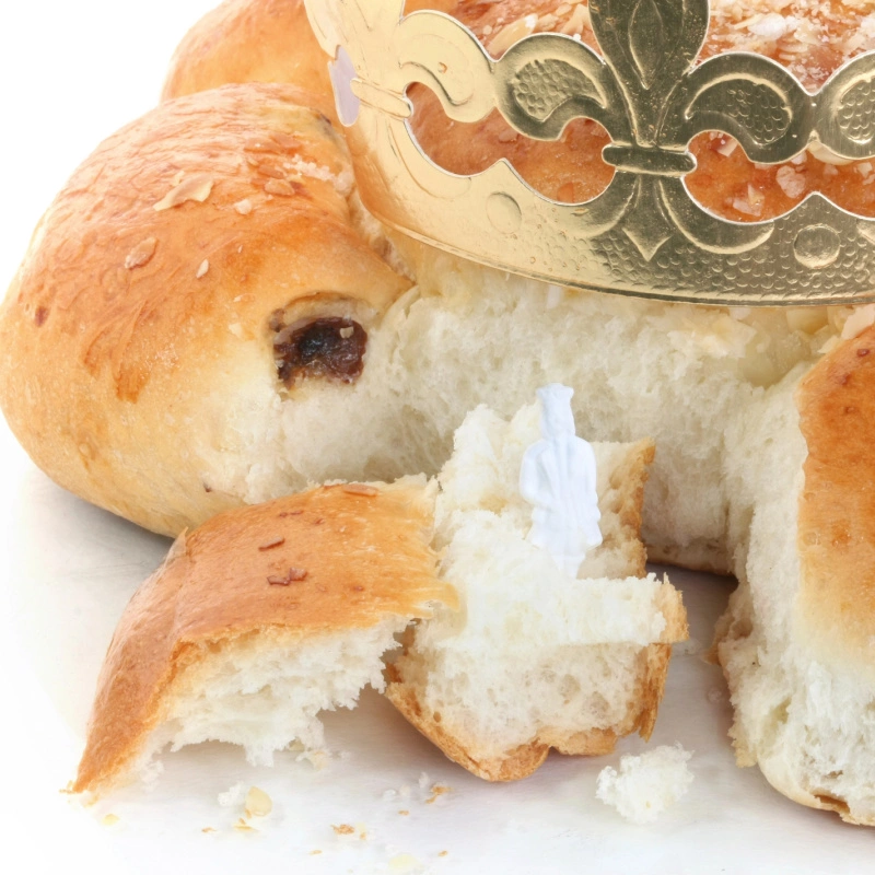 A "king" figurine hiding inside the Dreikönigskuchen.