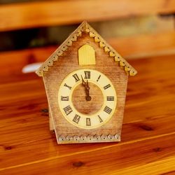 A wooden cuckoo clock on a kitchen table, an inherited object that helps with passing down German heritage in an American home.